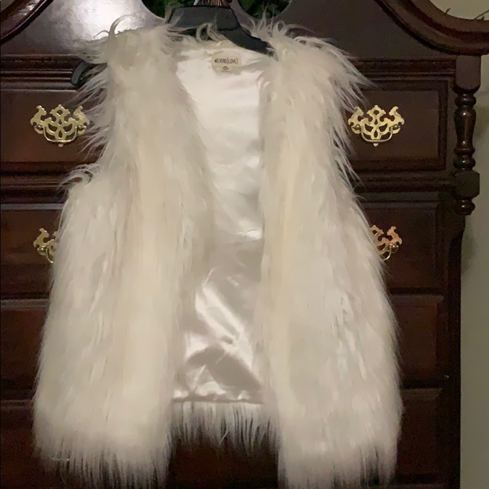 White fur vest